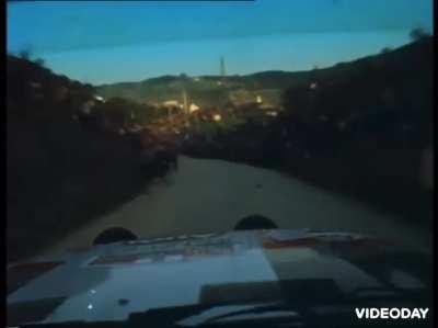 Driving a rally car by the crowd