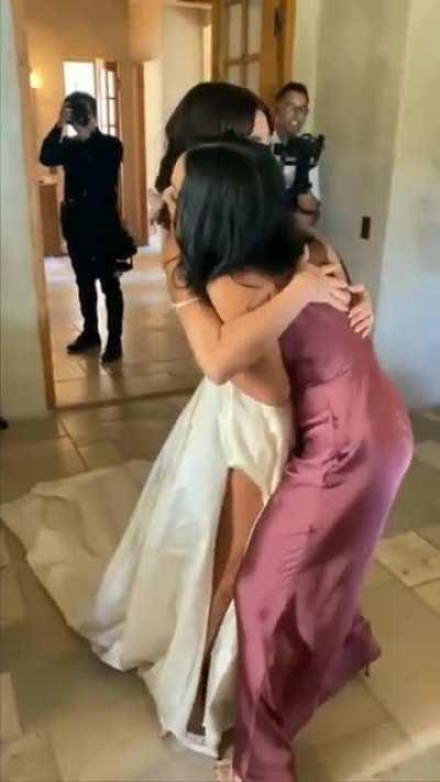 hugging the bride before the wedding