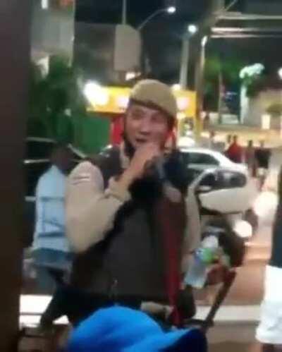 On Duty Brazilian Cop singing in pub