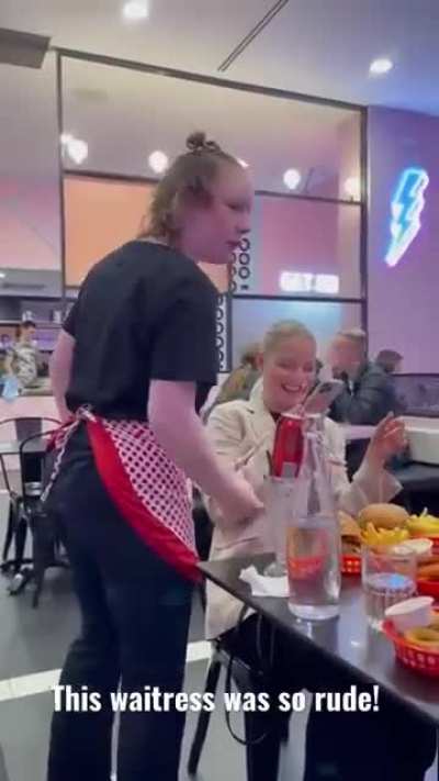 Waitress gets angry at customers on their phone
