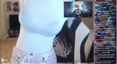 Emiru wearing a see-through shirt and showing off her bra