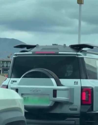 This car has a built in drone docking station which can deploy a drone to survey traffic