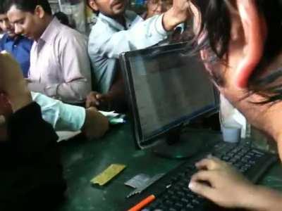 This receptionist at a busy pharmacy in India.