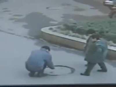 Throwing cigarettes in manhole