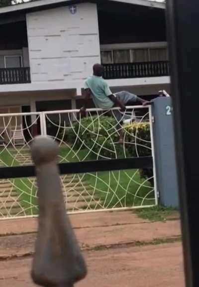 Next time you plan on robbing a house, learn how to climb a gate