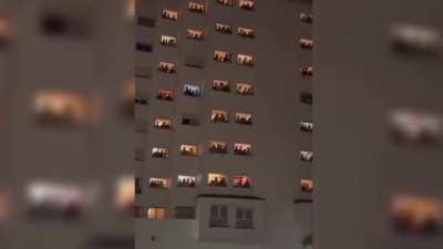 Students of the all-male college Elías Ahuja address their neighbours of the all-female college Santa Mónica