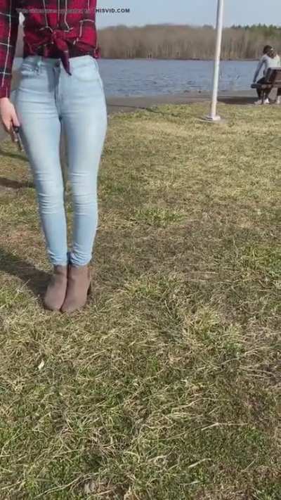 Girl pees her jeans in the park