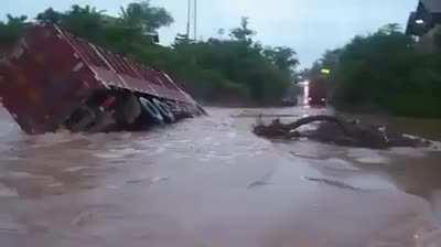 Trailer tried to go across the river, but did not make it, luckily the driver was not injured.