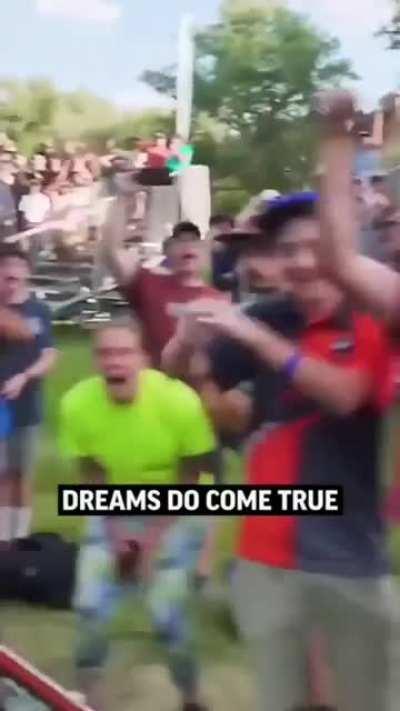 Disc golf player with a skilled throw.