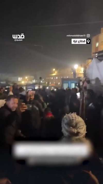 Palestinians in Gaza celebrate the ceasefire by shooting guns in the air