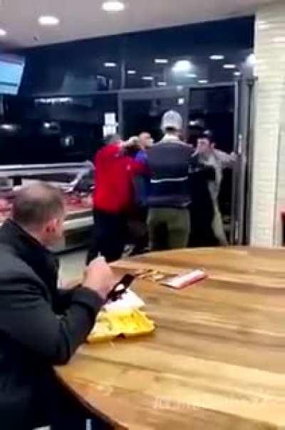 Man at table calm AF during restaurant fight