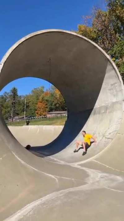 Playing with a ball inside a concrete cylinder