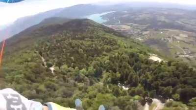 Paragliders collide at nearly 5,000ft and somehow manage to survive