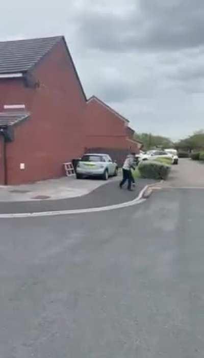 Two men fight in the street with knives