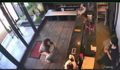 A woman walks into a store and takes a dump in front of the clerk