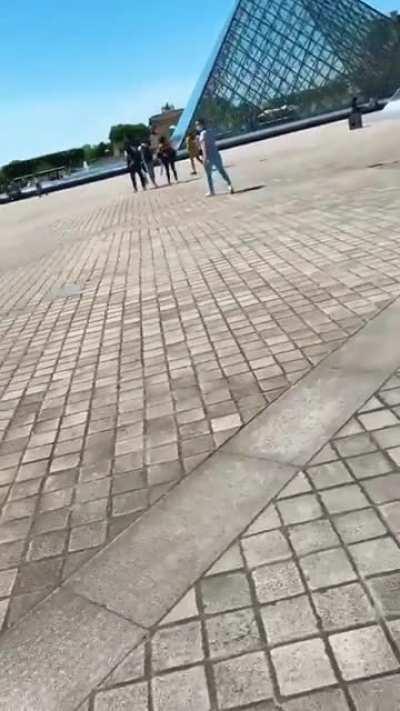 HMC going surfing on a friend's shoulder while she is on a scooter