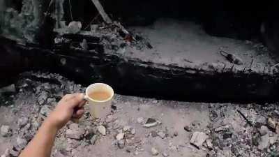 A Philippine SOC fighter carries coffee to his commander during the battle for the city of Marawi against an ISIS group. Video from 2017.