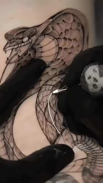 King cobra, black tattoo artwork by © Neon Tattoo Juelich.