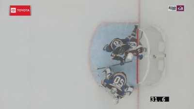 O’Connor is pushed into Blues goal, disallowing a goal. In the scrum, Binnington at a distance swings his stick at Kadri’s head