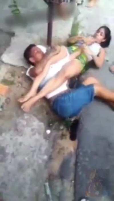 Girl grabs a man in a arm-lock, and threatens to break his arm and fingers