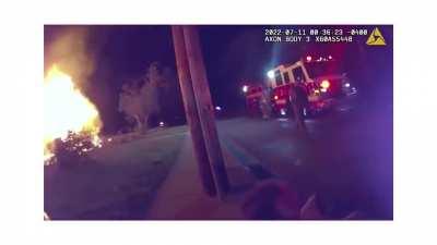 25 yo pizza delivery man runs into burning house, saves four children who tell him another might be in the house. He goes back in, finds the girl, jumps out a window with her, and carries her to a cop who captures the moment on his bodycam