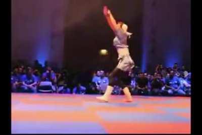 Chun Li cosplayer reenacts the character's moveset from SFxTekken during Capcom event