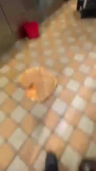 Worker jumps on pizza and slips.