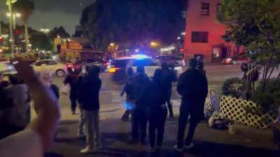 Rioters in Los Angeles are throwing bricks and rocks at moving cars again.