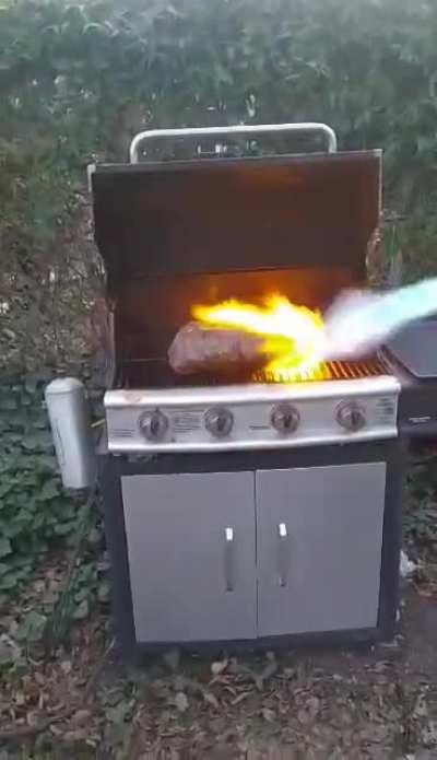 preparing the prime rib roast with a flamethrower😂