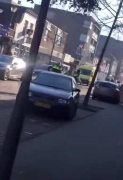 A guy high on drugs fighting the police and attacking cars