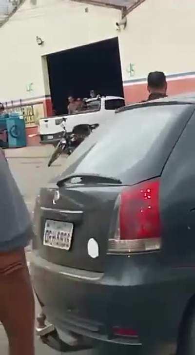 Man chases police officers from K-9 Battalion with a machete in Brazil, but there was a convenient guy with a coconut at the scene.