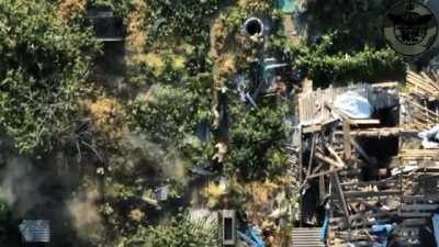 A Ukrainian Drone drops a munition on a group of Russian soldiers.