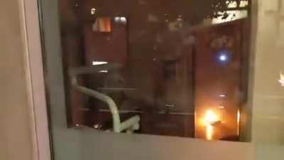 Peaceful Protesters setting a building on fire,while people sleeping!