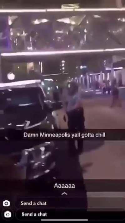 Rioter throws a heavy object at the head of a Minneapolis police officer, causing him to drop to the ground. People are rioting after a murder suspect shot himself in the head during an encounter with the police.