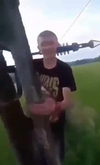 three guys climb an electric pole and one of them gets electrocuted 