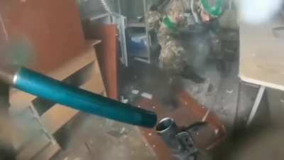 Ukrainian grenadier pair firing shells downrange during the Battle of Bakhmut (3-2023)