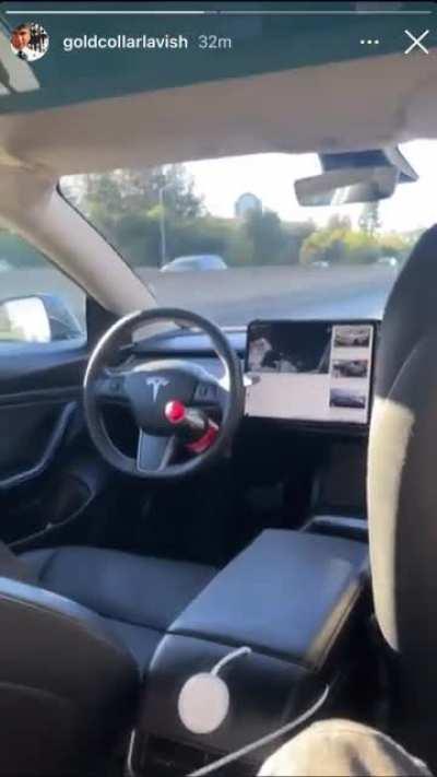 Man races supercars against his self driving Tesla while recording in the backseat.