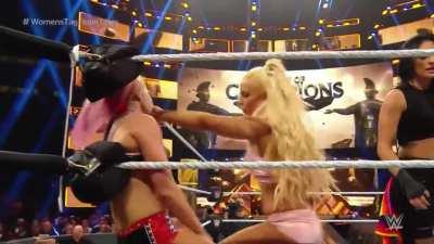 Mandy puts her hand over Alexa's mouth while her and Sonya stomp away at her stomach!