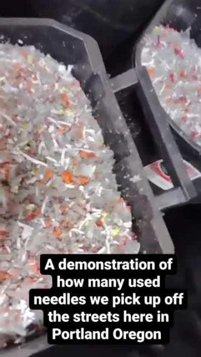 An employee of a bio cleaning company in Portland shows off how many used needles they cleaned up off the streets