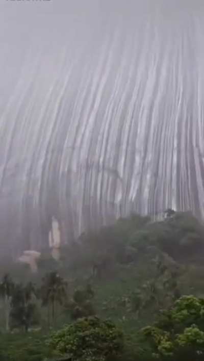 Waterfall over a mountain in Brazil after heavy rainfall. Estrela do norte, Brazil