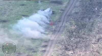 RU POV: FPV drone strikes a Ukrainian BTR-70 which makes it swerve into a minefield.