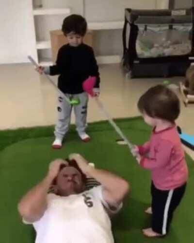 Footage of Abby playing golf with her dad when she was younger