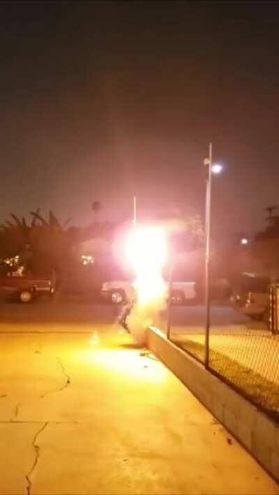 Someone launched a large 4 inch strobe rocket in the middle of a city, and manages to set off every car alarm on the block in the process.