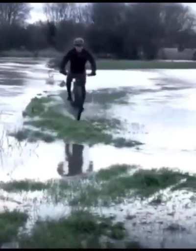 A bike ride through the water-filled streets