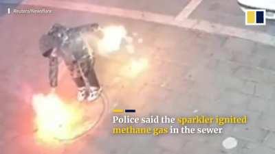 Kid puts firecracker in manhole