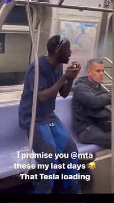 A typical 21st century commute on the NYC subway