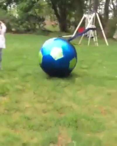 Playing kickball with dad