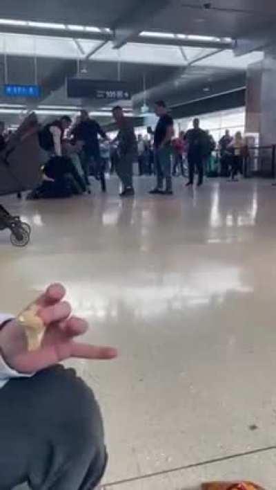 Drunken lads brawling on their way to holiday. how long they were able to carry that on in an airport is beyond me.