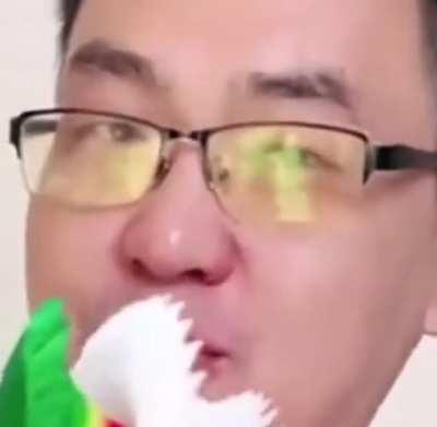 [Unknown>English] curious about if the man on the right is doing like a teaching video or something. Could someone please tell me what he is singing/saying and why he’s using the crepe paper on a stick? TIA!