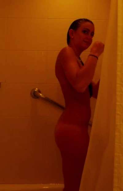 cute girl jiggles her butt in the shower